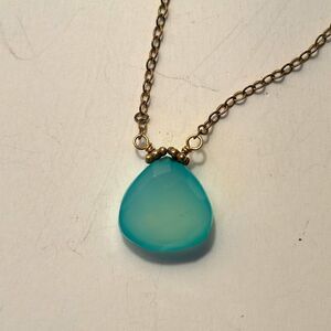 Dainty mint green faceted stone pendant on silver tone chain